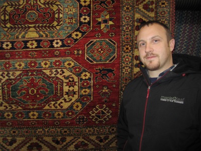 Picture of Maple Leaf company owner Clint West with rug